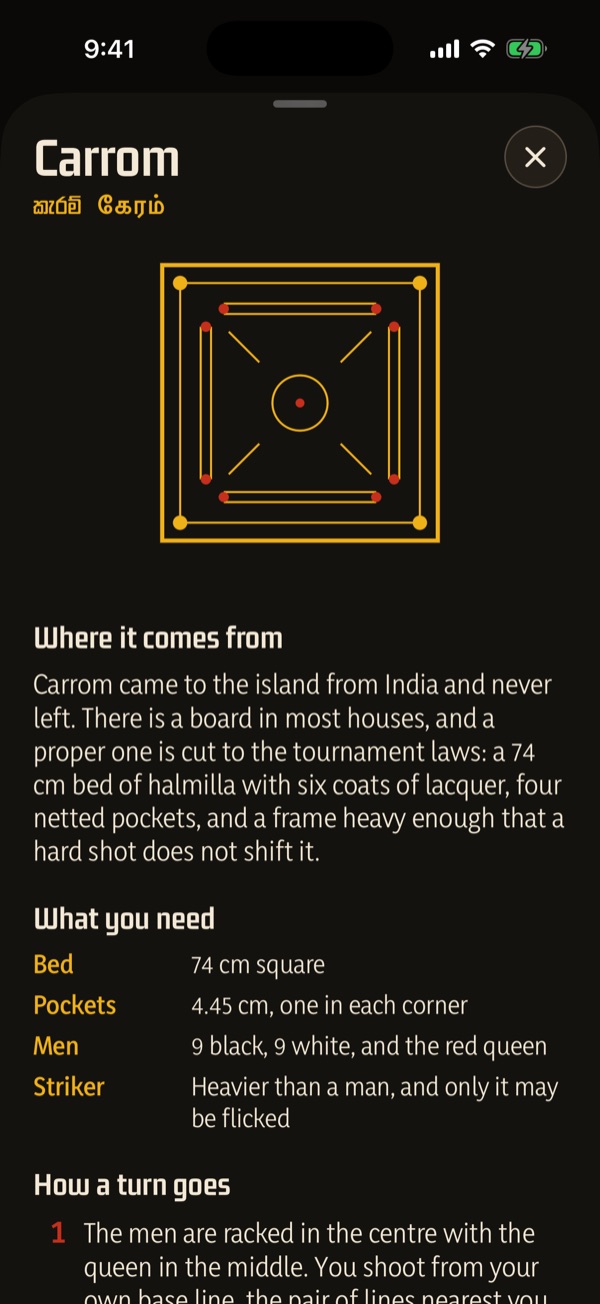 The how-to-play guide for carrom, open over the board